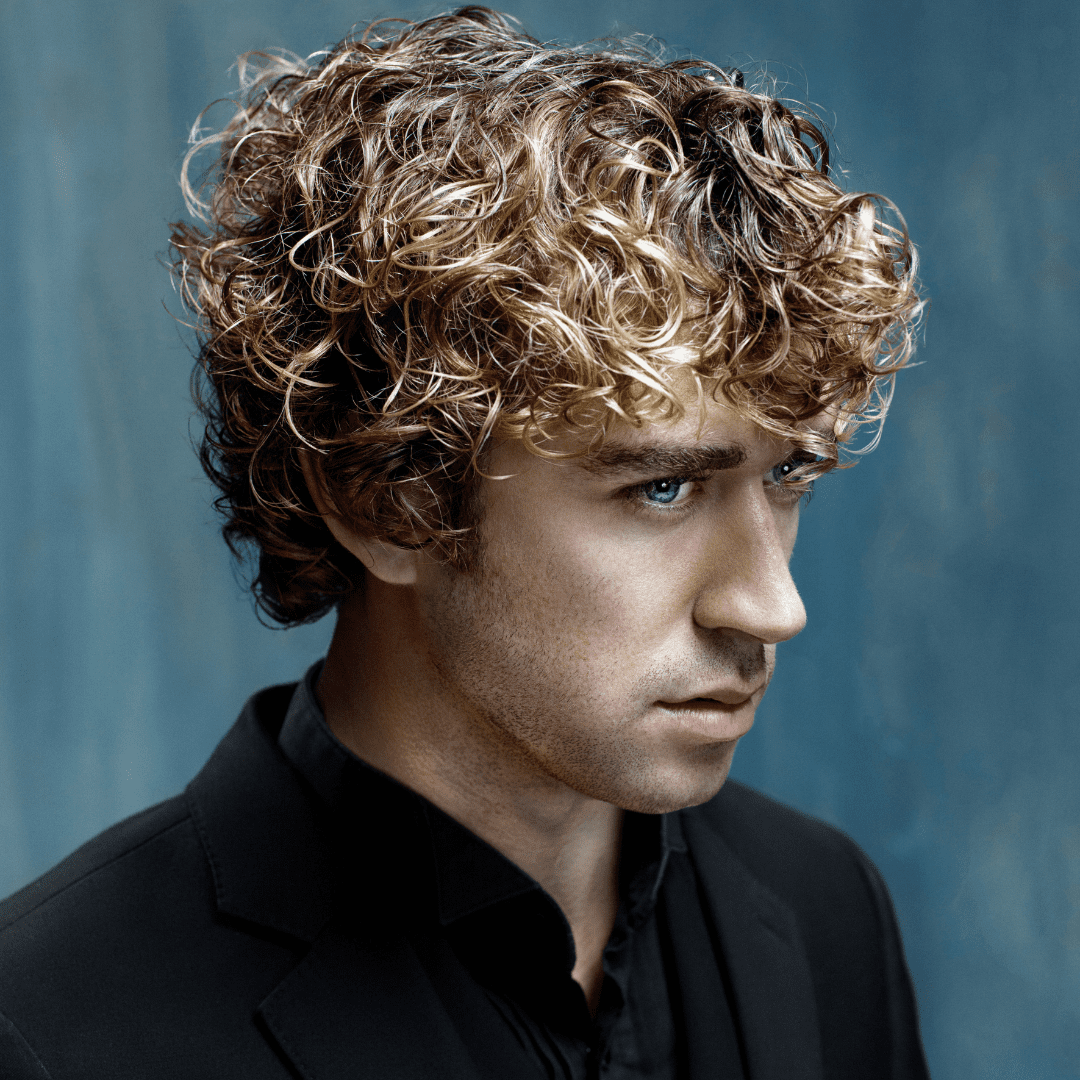 man with blonde curly hair