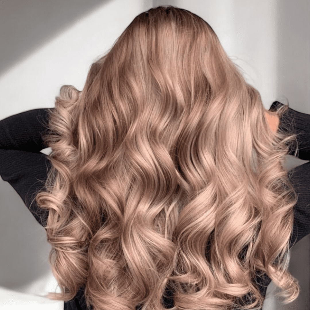 backview of woman with reddish blonde curled hair