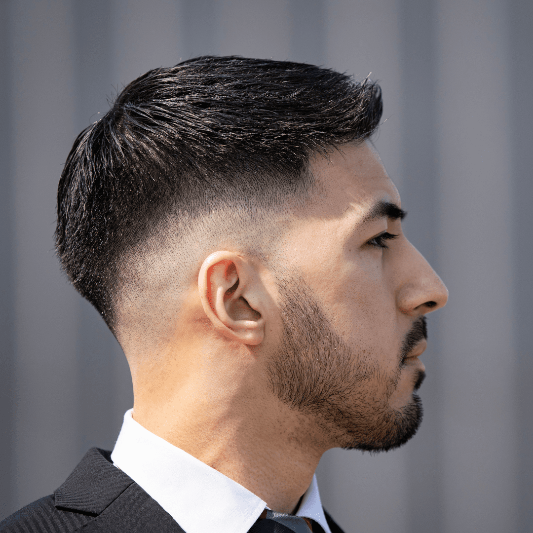 sideview of taper fade haircut on man in tuxedo