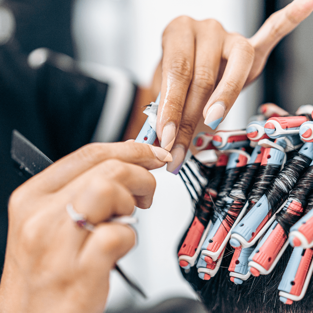 hair stylist fixing perm rods