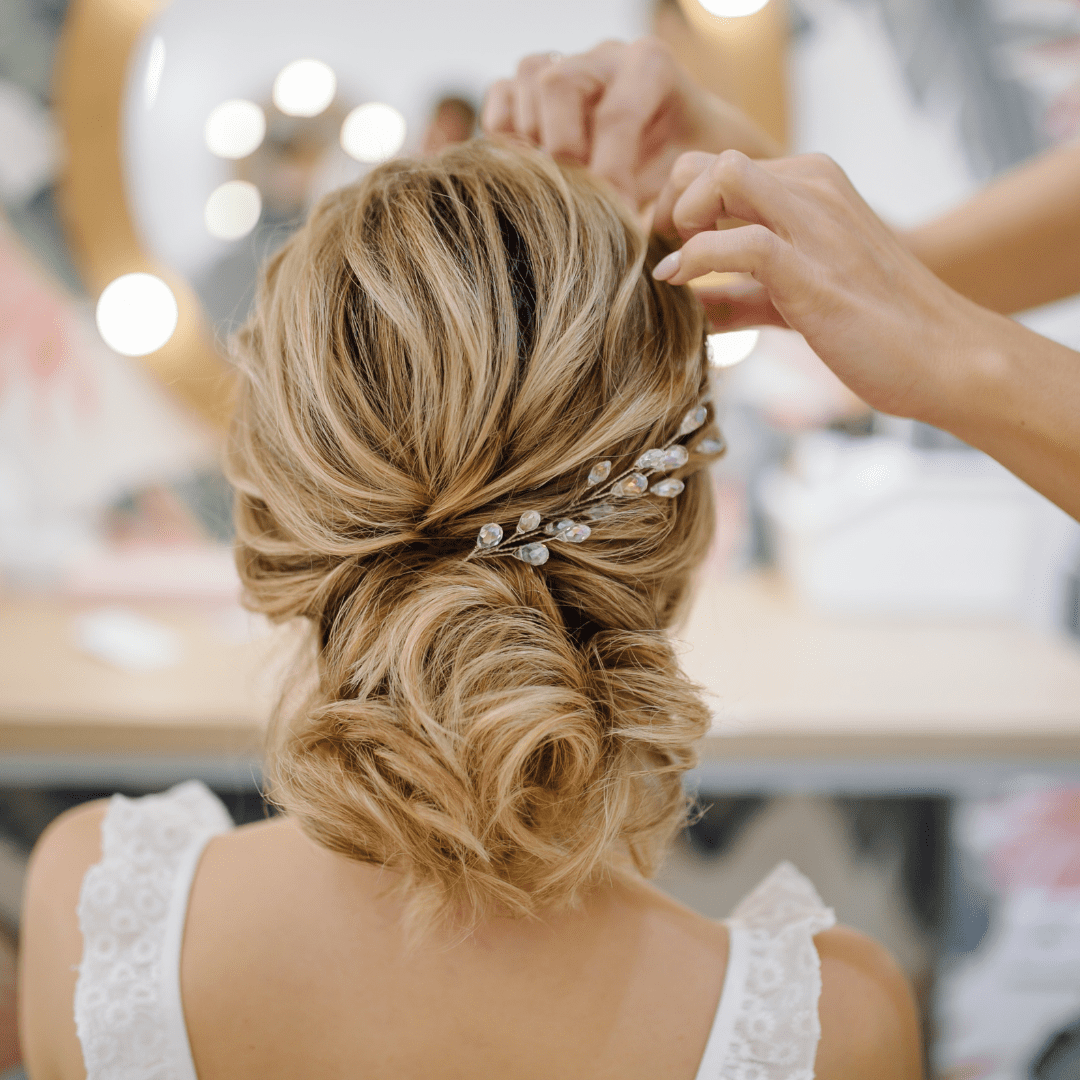 hairstylist working on wedding hair